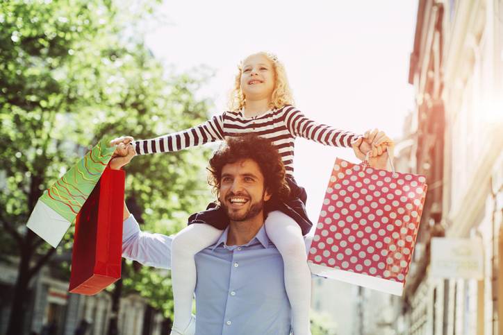 Father And Daughter Shopping Together.